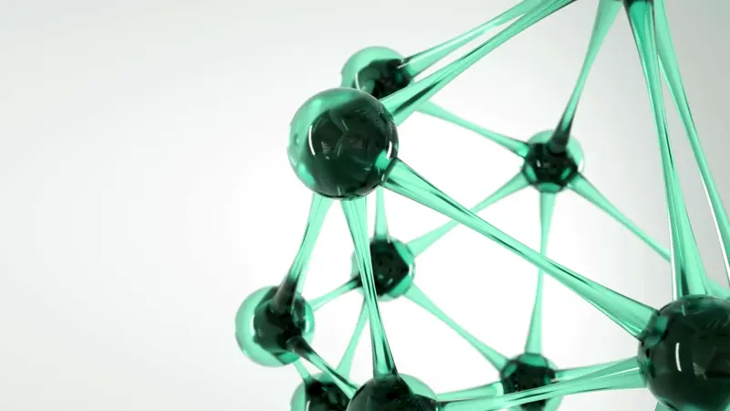 Close-up of a green translucent molecular structure model with interconnected spherical nodes and rods.